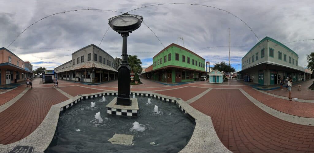 Old town Kissimmee Clock- wide angle view with stores in background