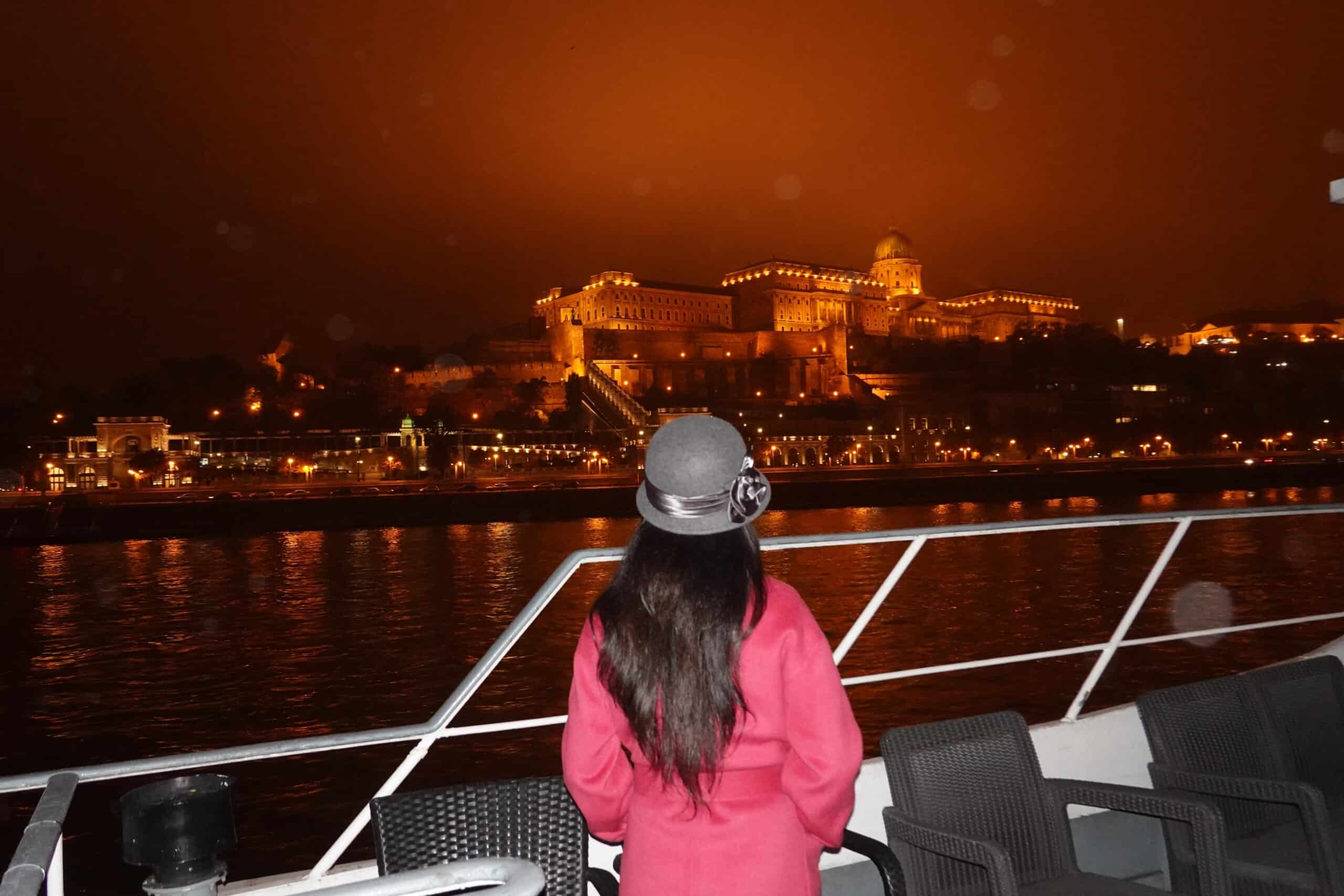 Buda Castle in Budapest at night from Danube River from river cruise
