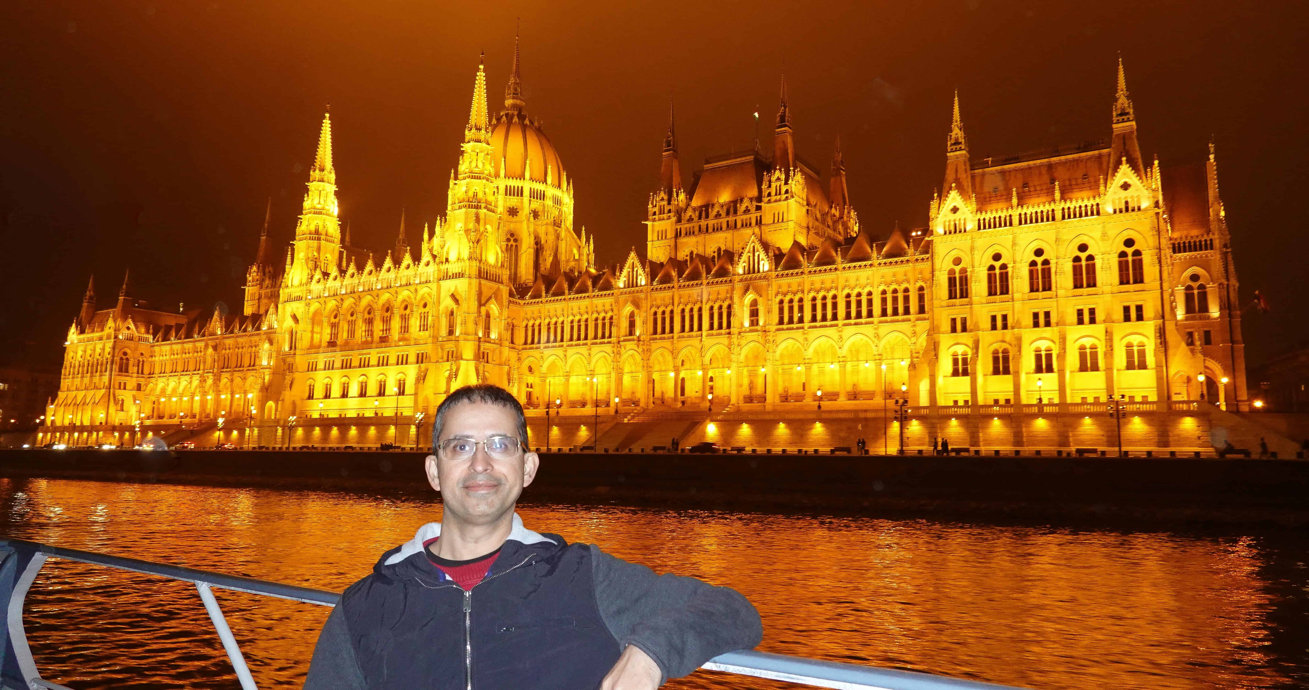 Hungarian Parliament building in Budapest at night from Danube River