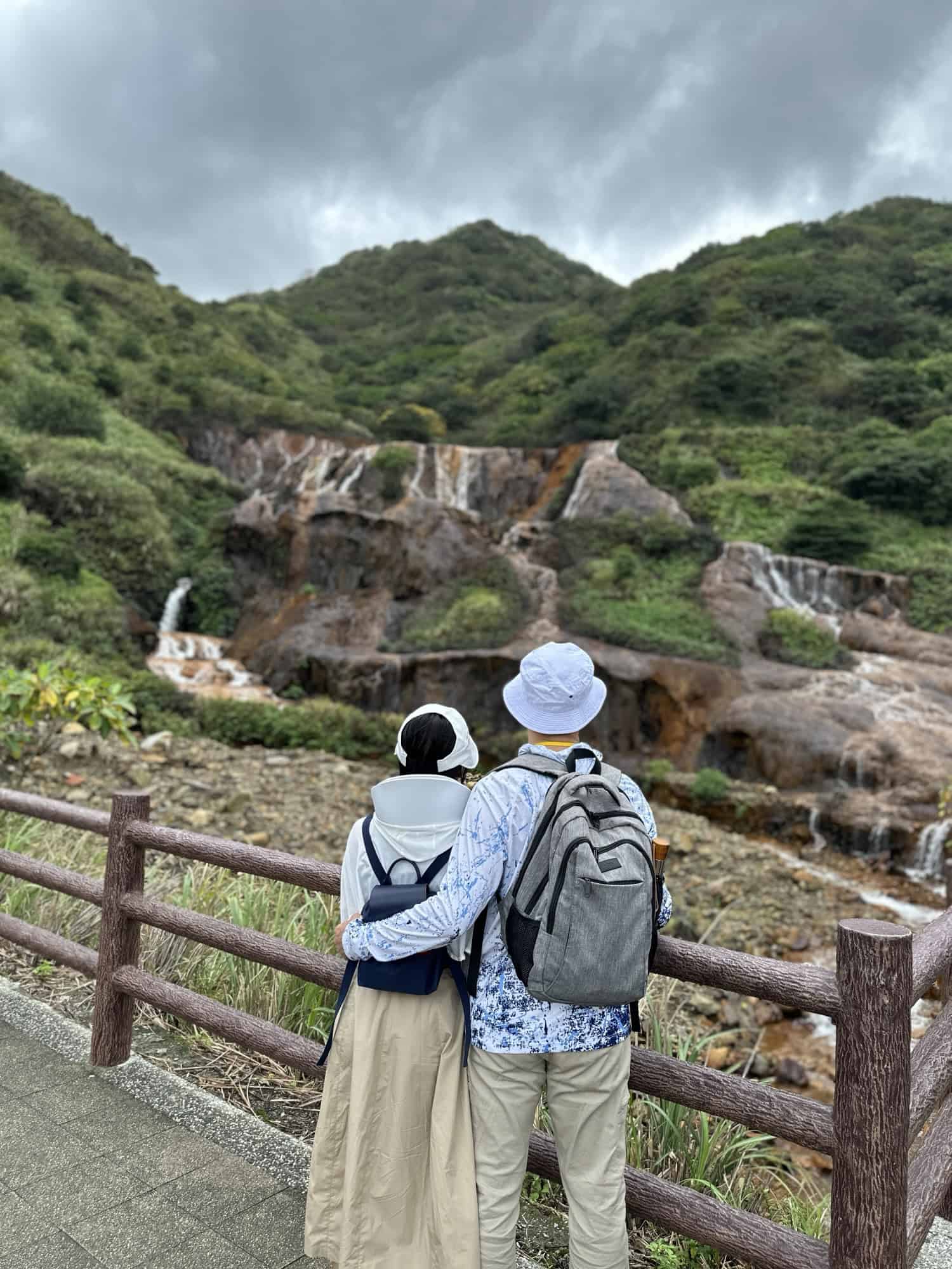 2 People looking at Golden waterfall near Taipei, Taiwan